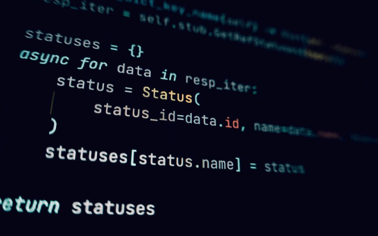Detailed view of programming code in a dark theme on a computer screen.