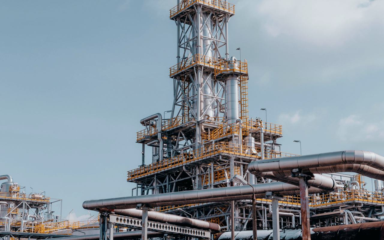 View of a large oil refinery plant with intricate pipelines in Trzebinia, Poland.